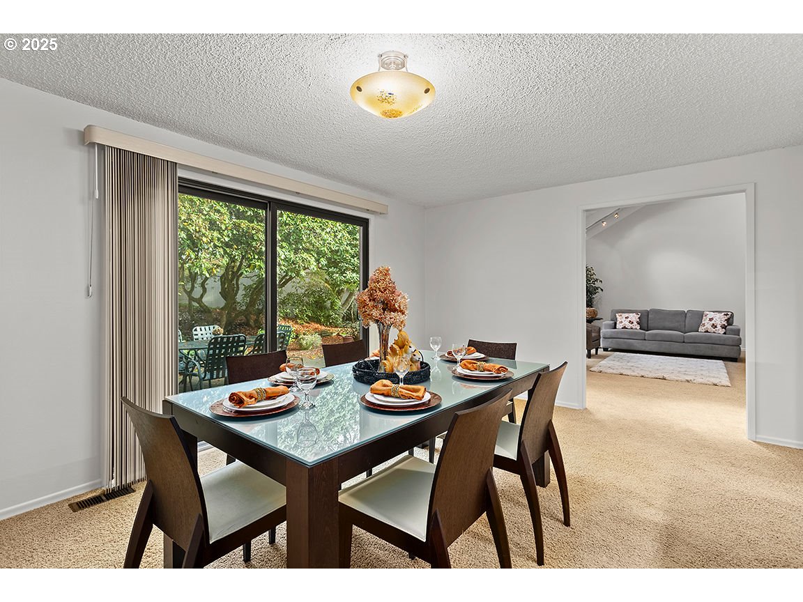 9 Britten Court Lake Oswego, OR 97035 - Photo 20 of 48 a view of a dining room with furniture window and outside view