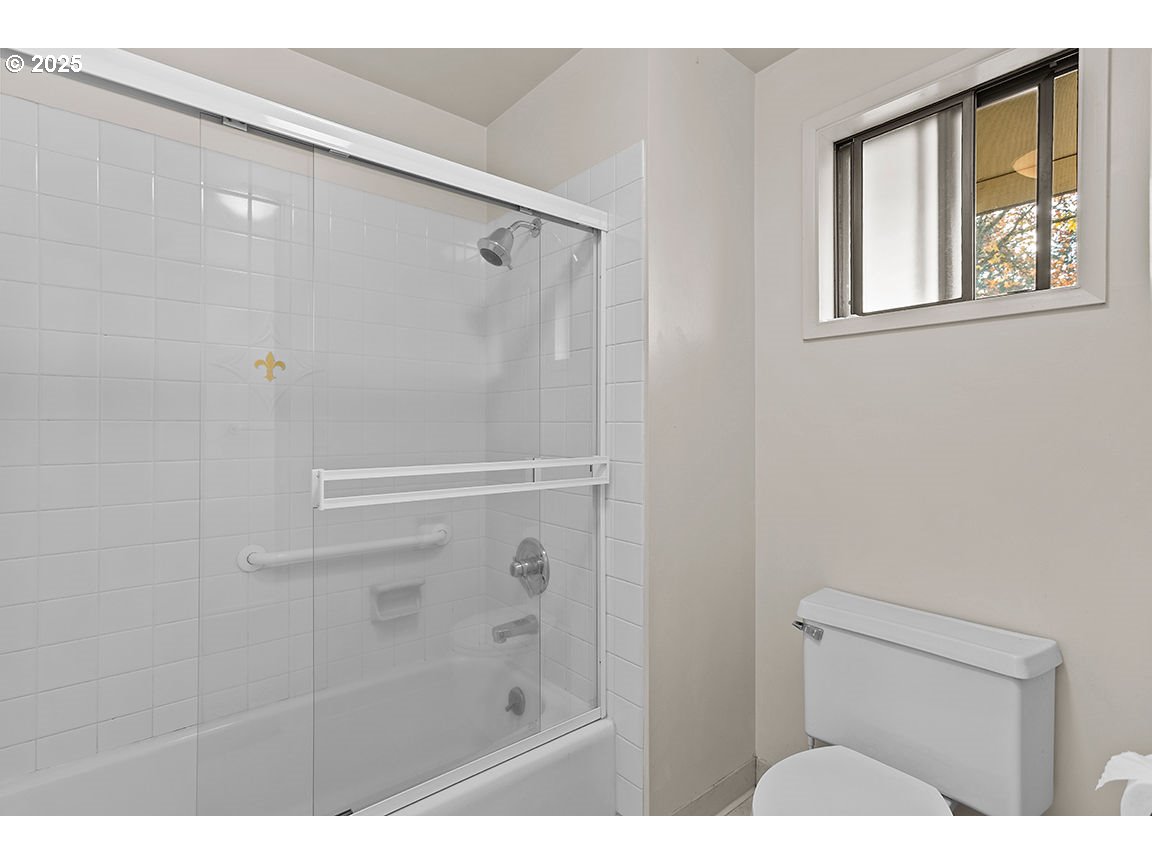 9 Britten Court Lake Oswego, OR 97035 - Photo 27 of 48 a bathroom with a shower and a wooden floor