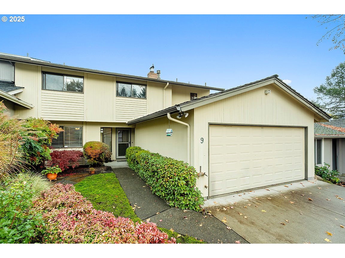 9 Britten Court Lake Oswego, OR 97035 - Photo 3 of 48 a front view of a house with a yard and garage