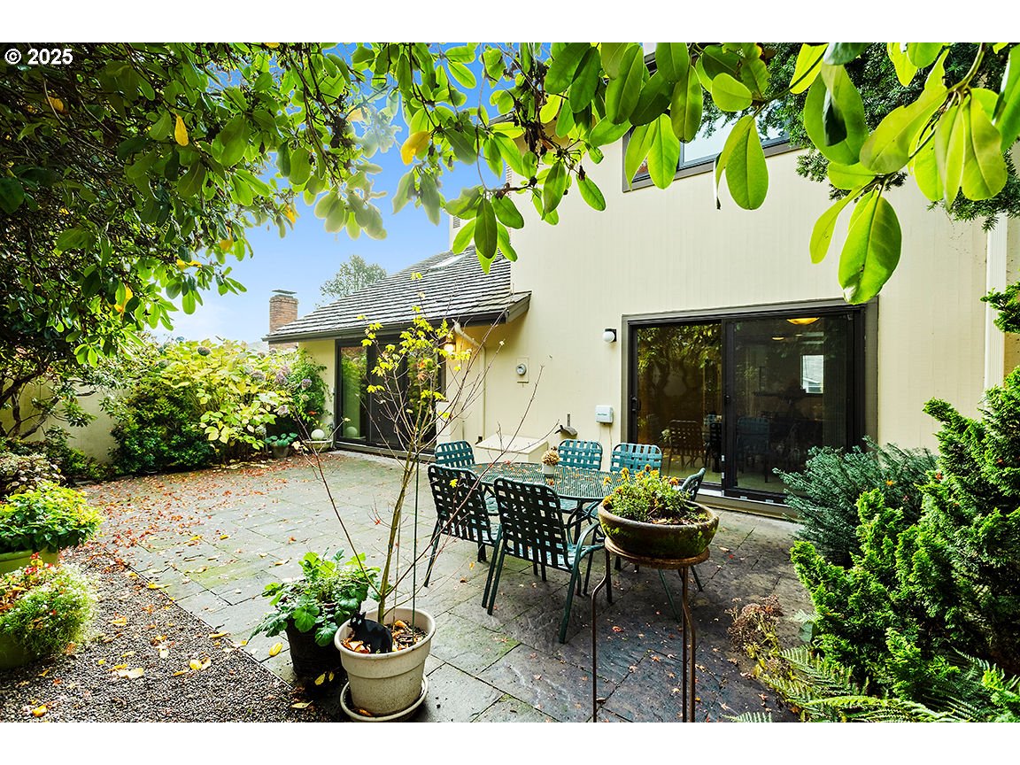 9 Britten Court Lake Oswego, OR 97035 - Photo 33 of 48 a view of a patio with table and chairs and potted plants
