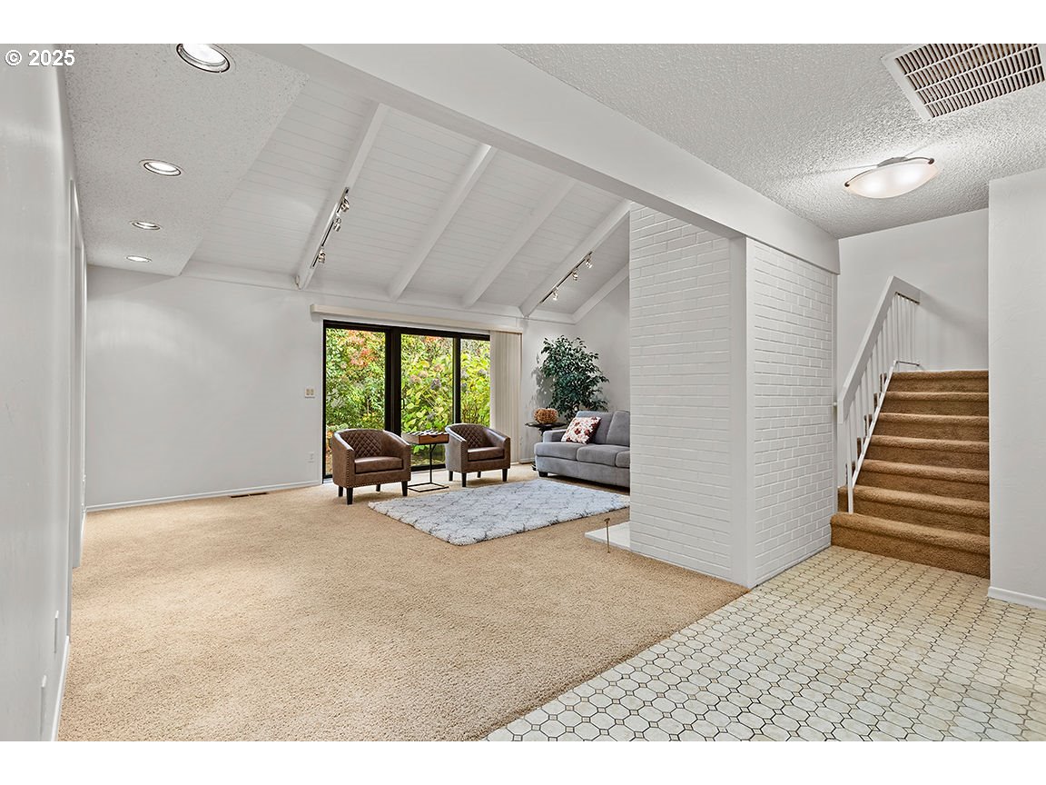 9 Britten Court Lake Oswego, OR 97035 - Photo 5 of 48 a view of a livingroom with furniture and floor to ceiling window