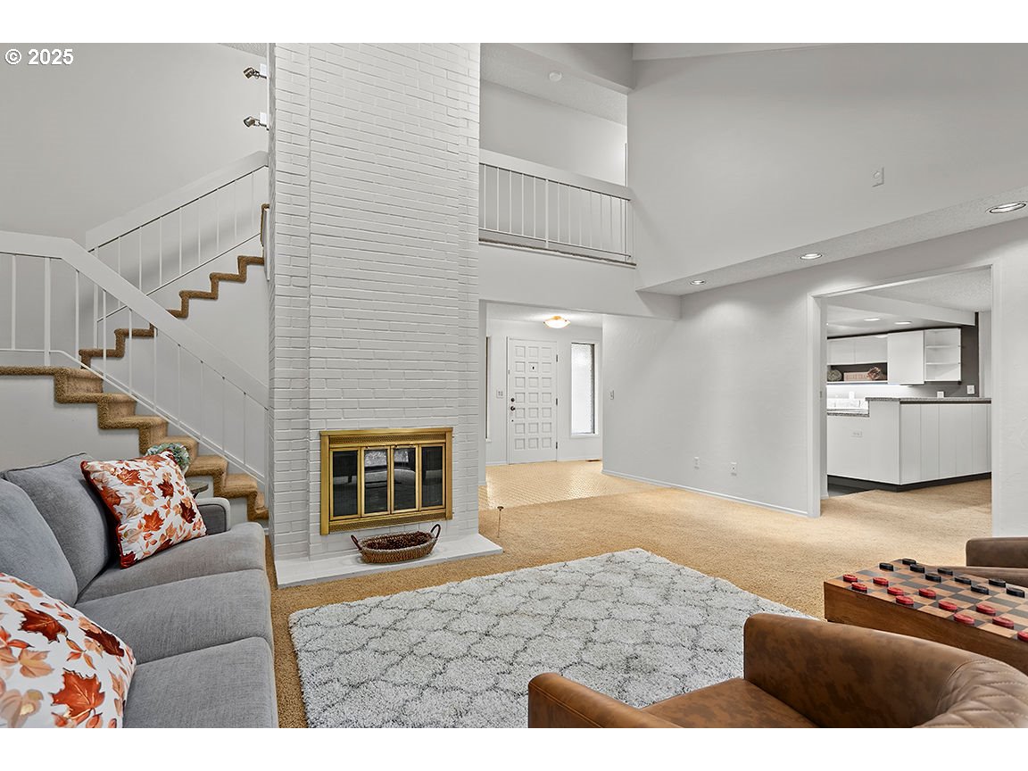 9 Britten Court Lake Oswego, OR 97035 - Photo 7 of 48 a living room with furniture and a fireplace