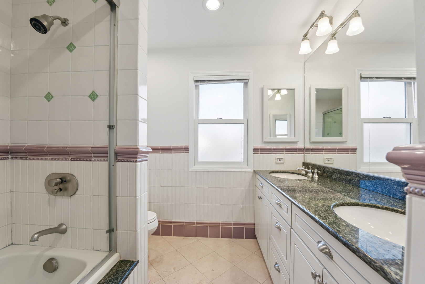 1500 Gordon Terrace Deerfield, IL 60015 - Photo 26 of 36 a bathroom with a granite countertop tub sink and mirror