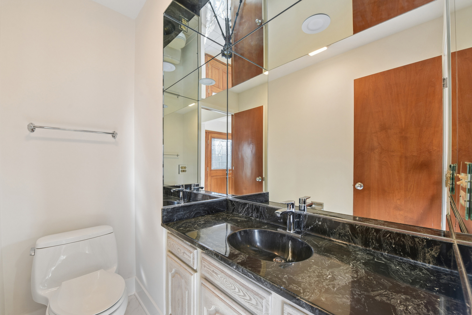 1500 Gordon Terrace Deerfield, IL 60015 - Photo 28 of 36 a bathroom with a granite countertop sink and a mirror