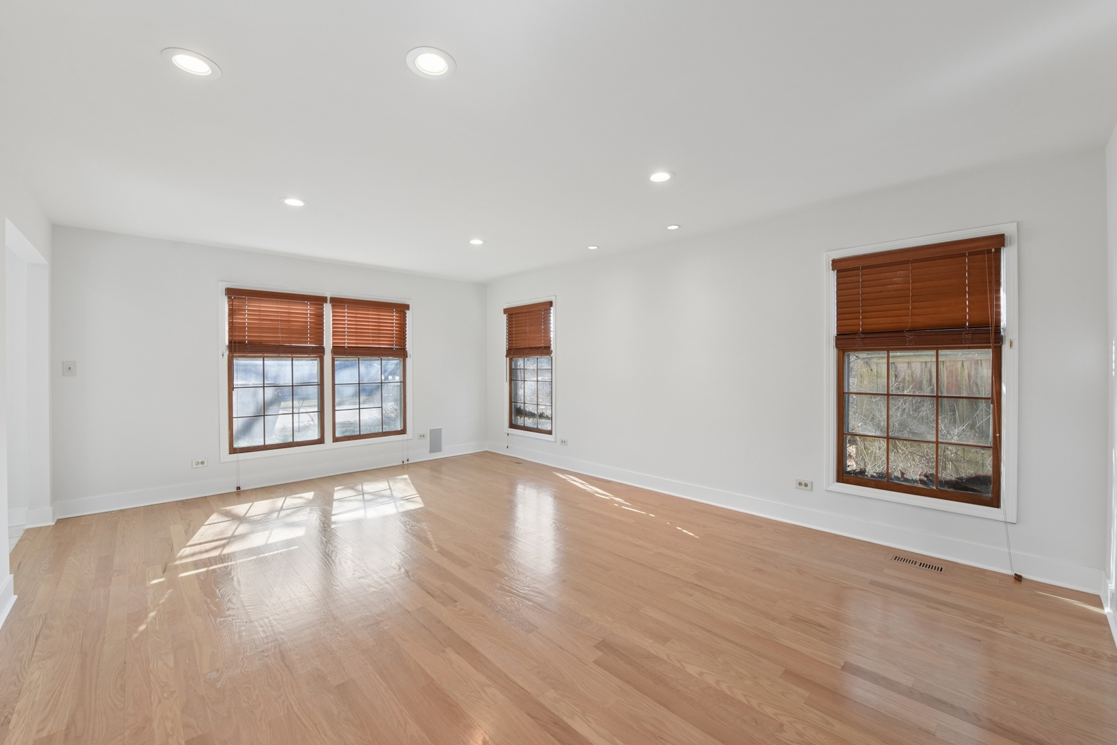 1500 Gordon Terrace Deerfield, IL 60015 - Photo 7 of 36 an empty room with wooden floor and windows