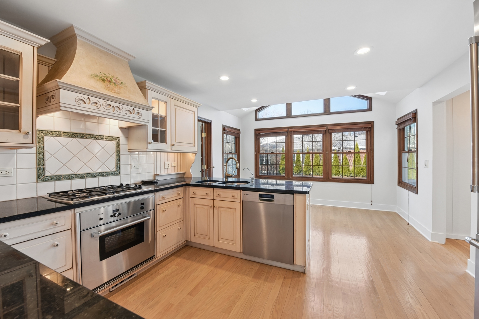1500 Gordon Terrace Deerfield, IL 60015 - Photo 10 of 36 a kitchen with stainless steel appliances granite countertop a stove and a sink