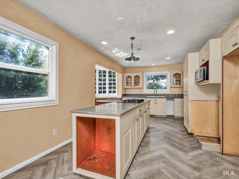315 White Cottage Road North Angwin, CA 94508 - Photo 5 of 9 a kitchen with stainless steel appliances granite countertop a stove top oven a refrigerator a sink and a refrigerator