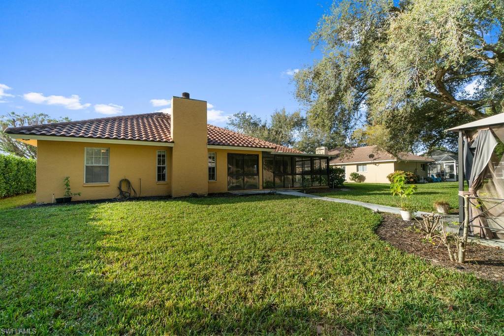 560 Henley Drive Naples, FL 34104 - Photo 16 of 16 a view of a house with backyard