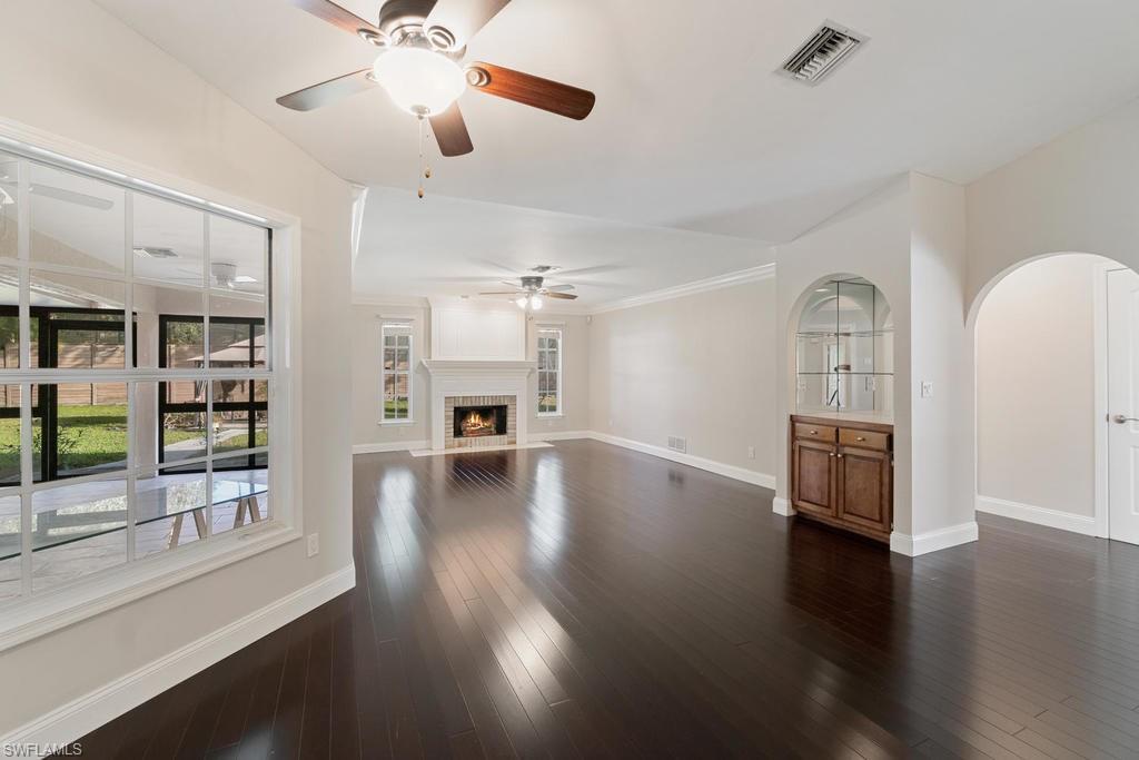 560 Henley Drive Naples, FL 34104 - Photo 5 of 16 a view of livingroom with hardwood floor and ceiling fan
