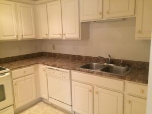 4448 Pheasant Ridge Road, Unit 303 Roanoke, VA 24014 - Photo 2 of 8 a kitchen with white cabinets and a sink