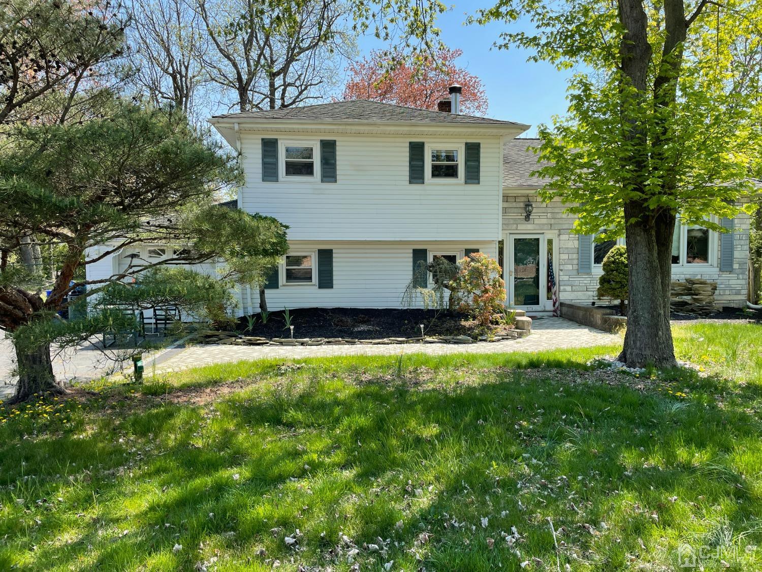 225 Gordon Road Old Bridge, NJ 07747 - Photo 1 of 6 a front view of house with yard and trees