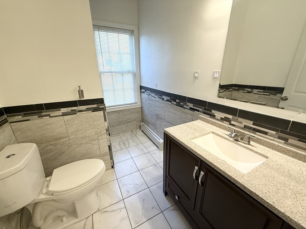 592 Westminster Hill Road Fitchburg, MA 01420 - Photo 7 of 21 a bathroom with a sink a toilet and a mirror
