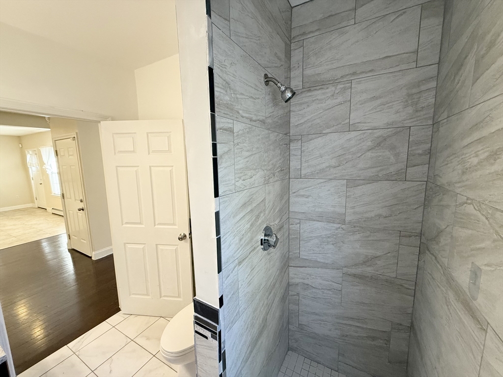 592 Westminster Hill Road Fitchburg, MA 01420 - Photo 8 of 21 a bathroom with a glass door shower