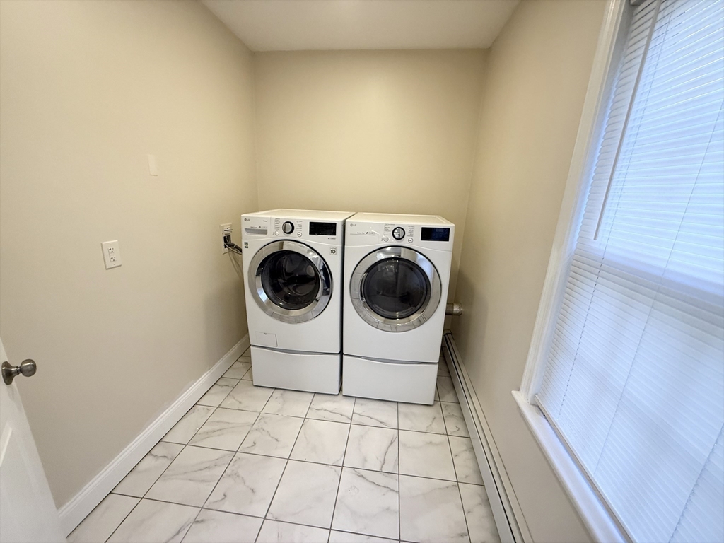 592 Westminster Hill Road Fitchburg, MA 01420 - Photo 9 of 21 a utility room with dryer and washer