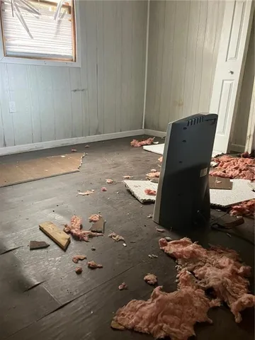 an empty room with a fireplace