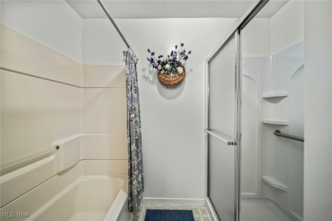 1861 Sterling Road Madison, OH 44057 - Photo 19 of 37 Bathroom with walk in shower & tub shower