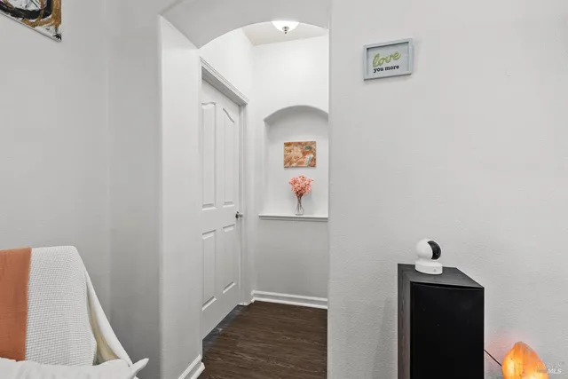 a view of an entryway with wooden floor