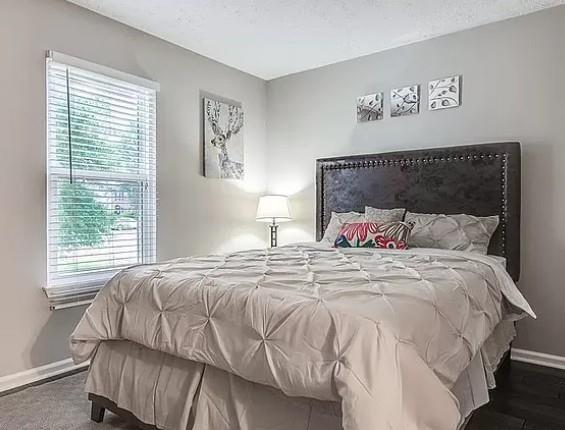 1565 Springleaf Court Southeast Smyrna, GA 30080 - Photo 14 of 23 a bedroom with a bed and a window