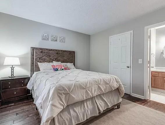1565 Springleaf Court Southeast Smyrna, GA 30080 - Photo 15 of 23 a bedroom with a bed and a night stand