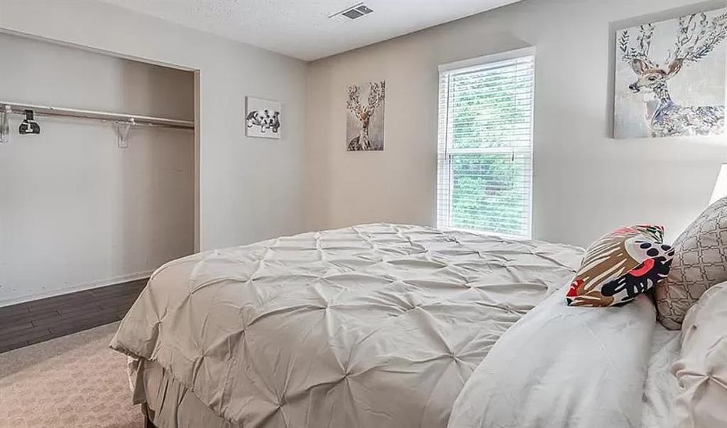 1565 Springleaf Court Southeast Smyrna, GA 30080 - Photo 16 of 23 a bedroom with a bed and a window