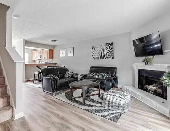 1565 Springleaf Court Southeast Smyrna, GA 30080 - Photo 4 of 23 a living room with furniture and a fireplace