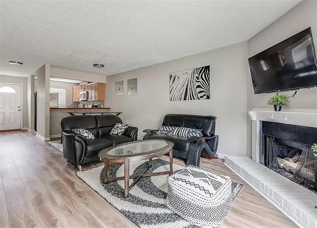 1565 Springleaf Court Southeast Smyrna, GA 30080 - Photo 5 of 23 a living room with furniture and a flat screen tv