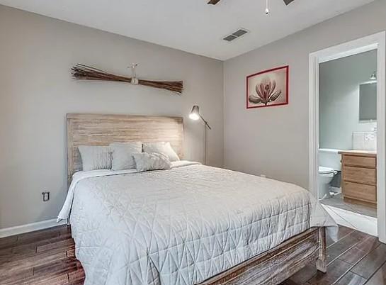 1565 Springleaf Court Southeast Smyrna, GA 30080 - Photo 10 of 23 a bedroom with a bed and painting on the wall