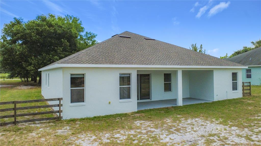 28549 Shirley Shores Road Tavares, FL 32778 - Photo 58 of 65 a view of a house with a yard