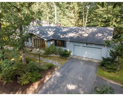 141 Brooks Road Longmeadow, MA 01106 - Photo 1 of 25 a front view of a house with a yard and garage