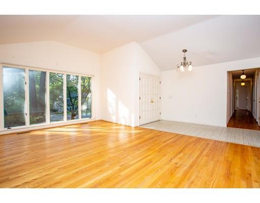141 Brooks Road Longmeadow, MA 01106 - Photo 3 of 25 a view of an empty room with wooden floor and a window