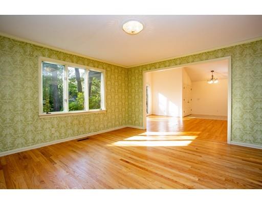 141 Brooks Road Longmeadow, MA 01106 - Photo 4 of 25 a view of empty room with wooden floor and fan