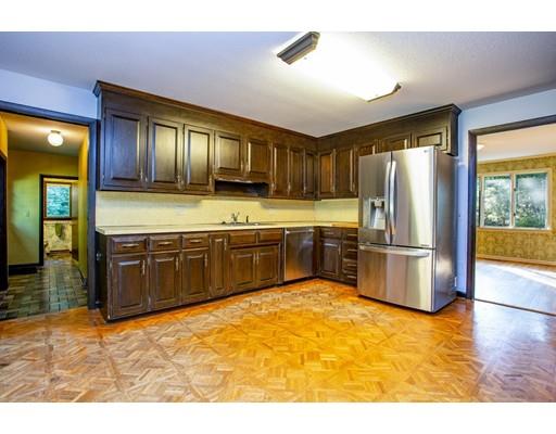 141 Brooks Road Longmeadow, MA 01106 - Photo 6 of 25 a kitchen with stainless steel appliances granite countertop a refrigerator a sink a stove and island