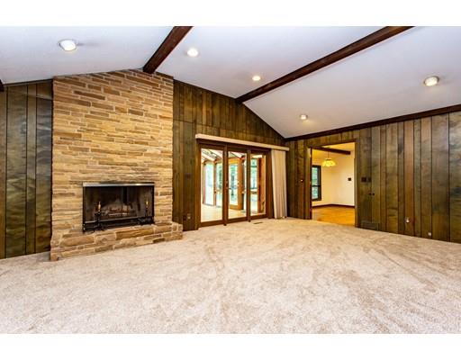 141 Brooks Road Longmeadow, MA 01106 - Photo 8 of 25 a large room with a fireplace and a large window
