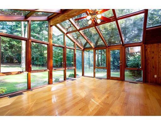 141 Brooks Road Longmeadow, MA 01106 - Photo 10 of 25 a view of an empty room with wooden floor and iron fence