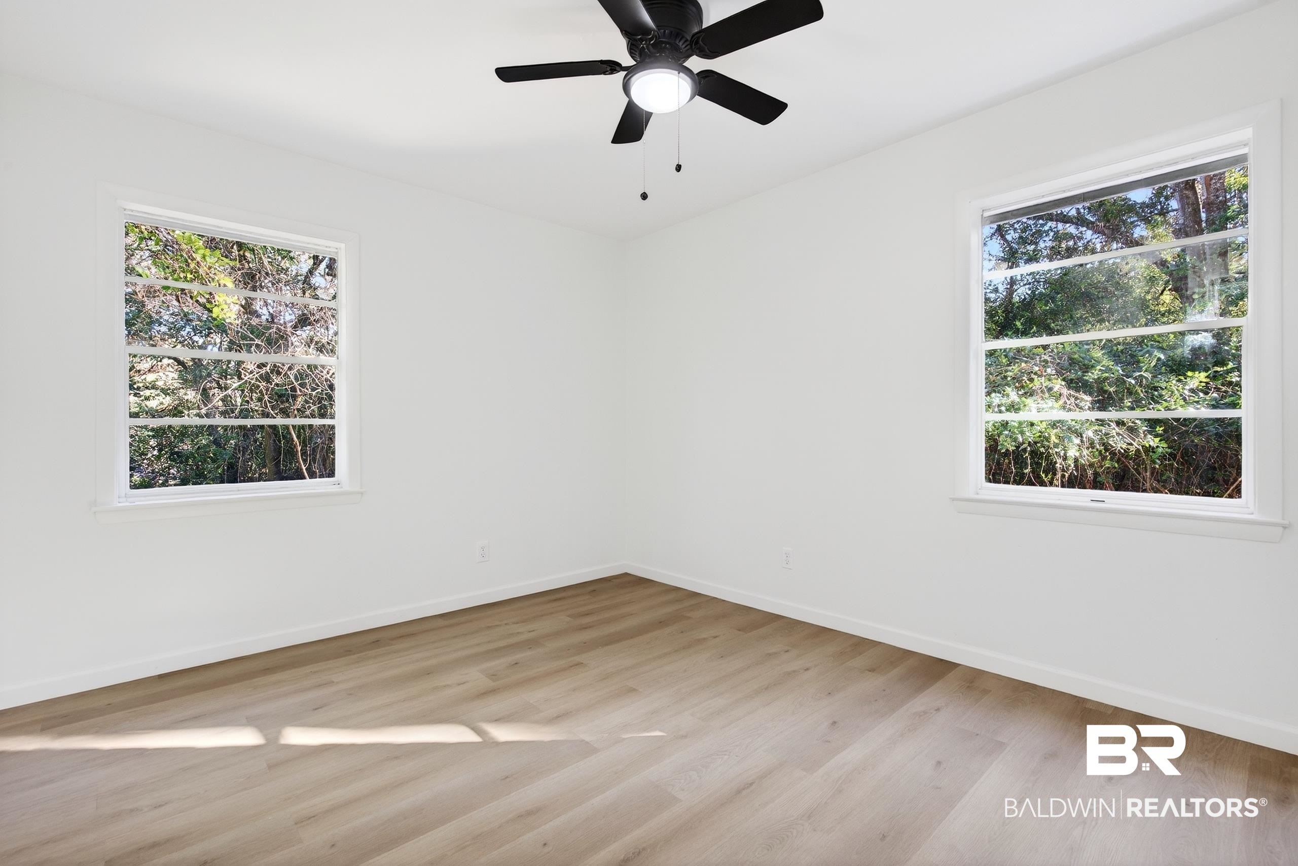30902 Stanton Road Spanish Fort, AL 36527 - Photo 13 of 27 Unfurnished room with light wood-style flooring and a ceiling fan