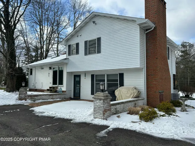a front view of a house with a patio