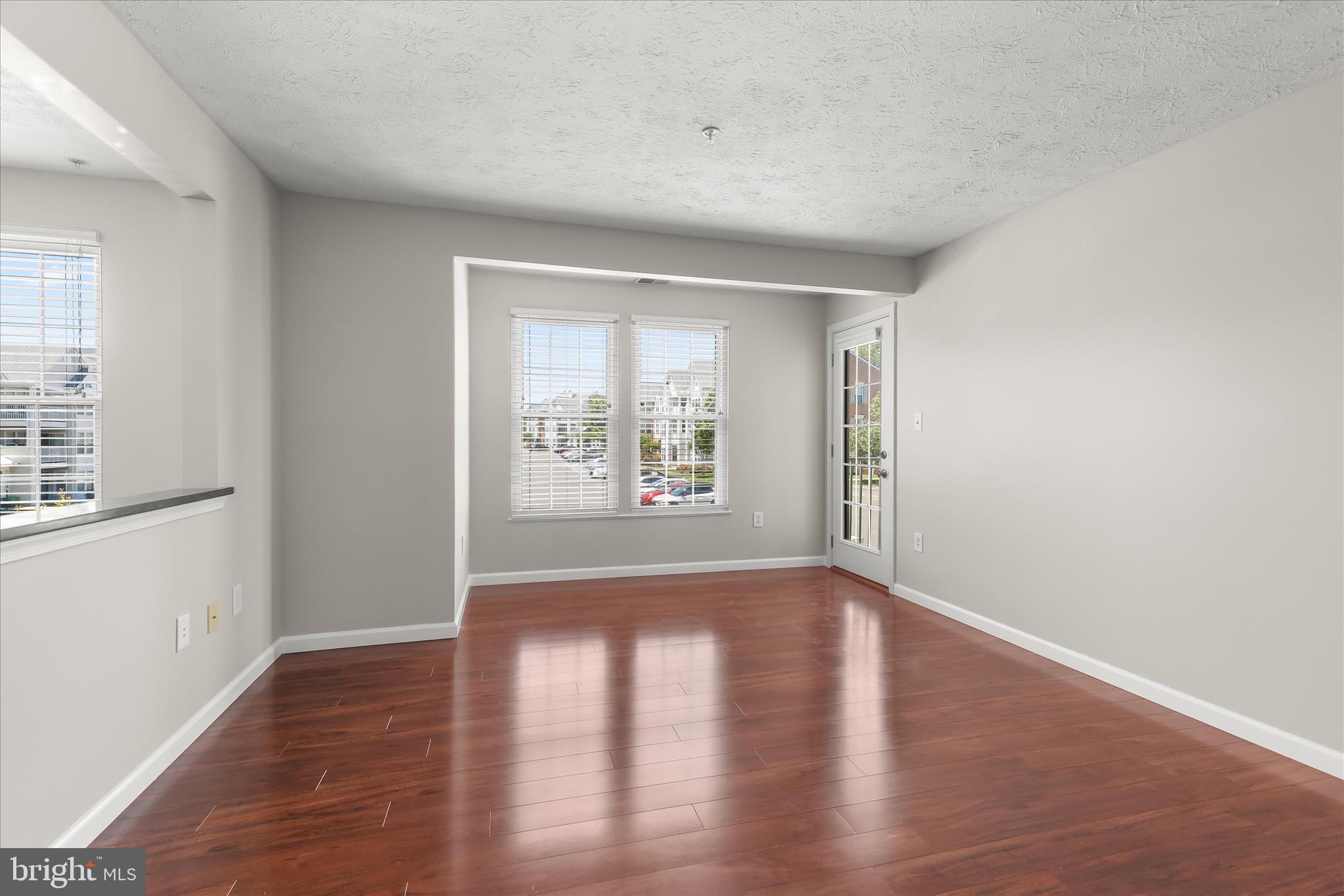 687 Winding Stream Way, Unit 204 Odenton, MD 21113 - Photo 10 of 36 Living area with balcony access