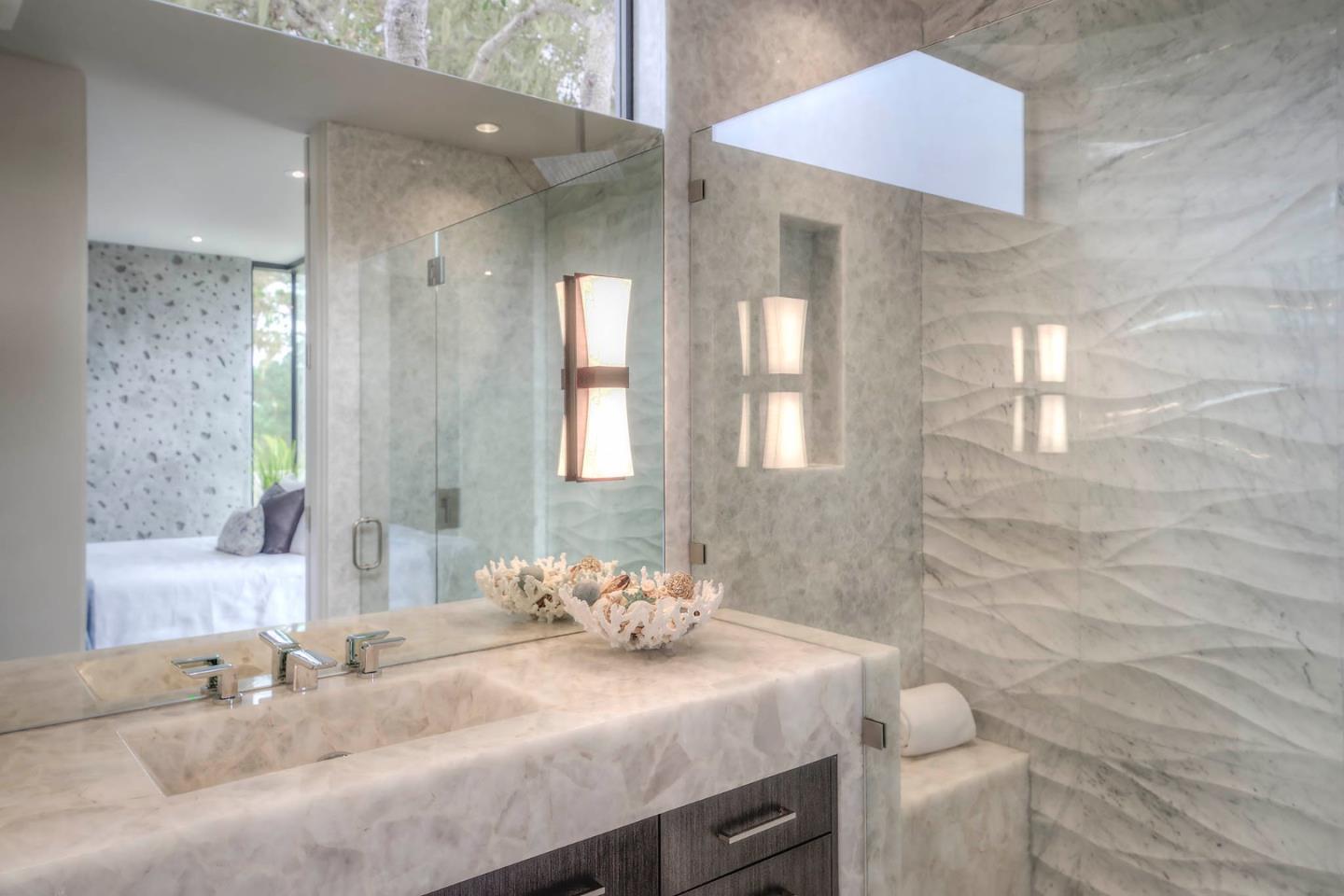 2889 17 Mile Drive Pebble Beach, CA 93953 - Photo 15 of 17 a bathroom with a granite countertop sink a toilet and a mirror