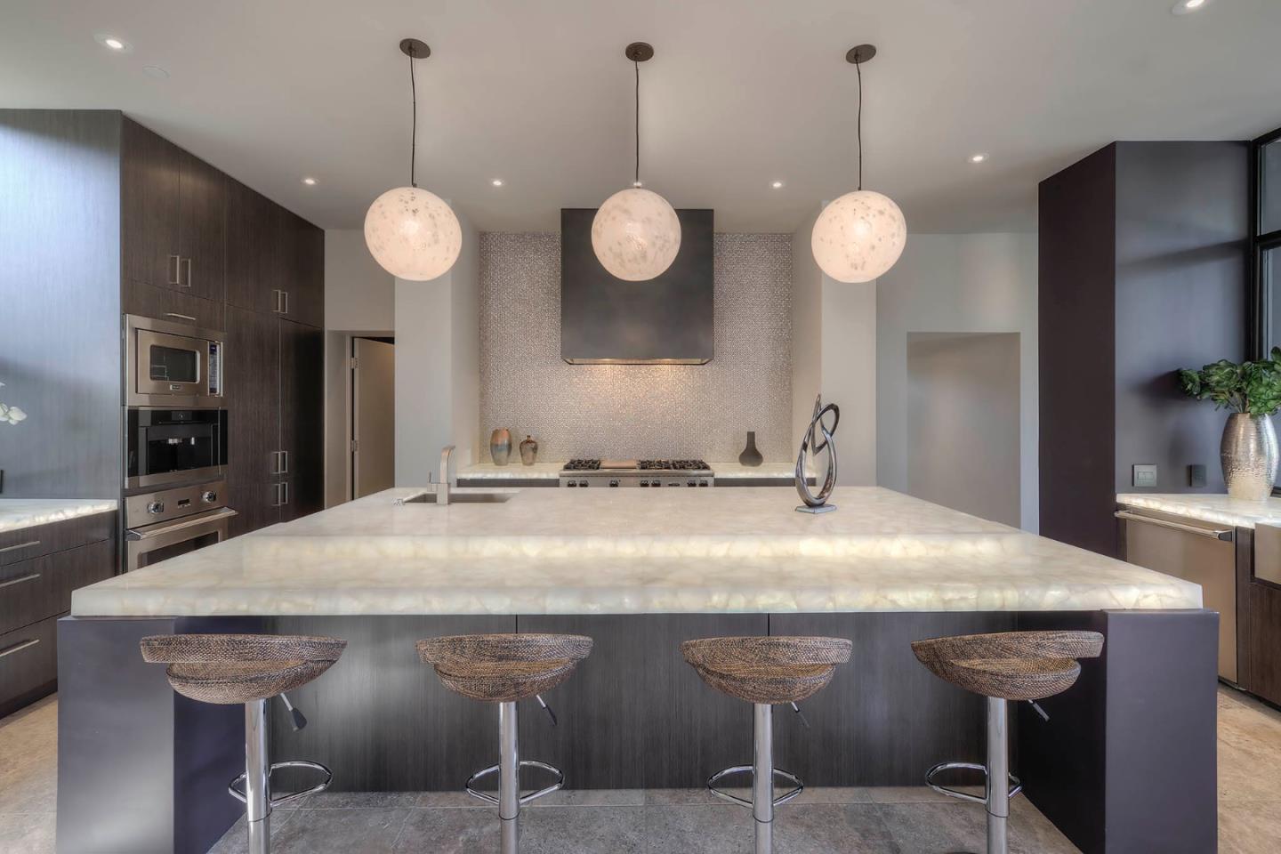 2889 17 Mile Drive Pebble Beach, CA 93953 - Photo 6 of 17 a kitchen with a table and chairs in it