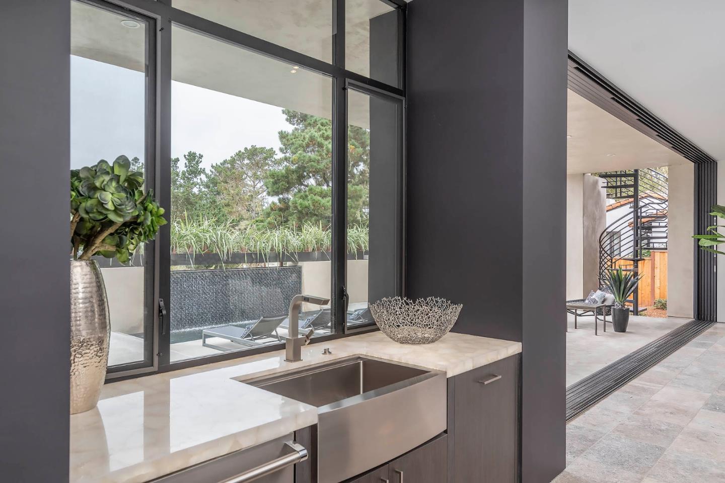 2889 17 Mile Drive Pebble Beach, CA 93953 - Photo 8 of 17 a kitchen with a sink and large window
