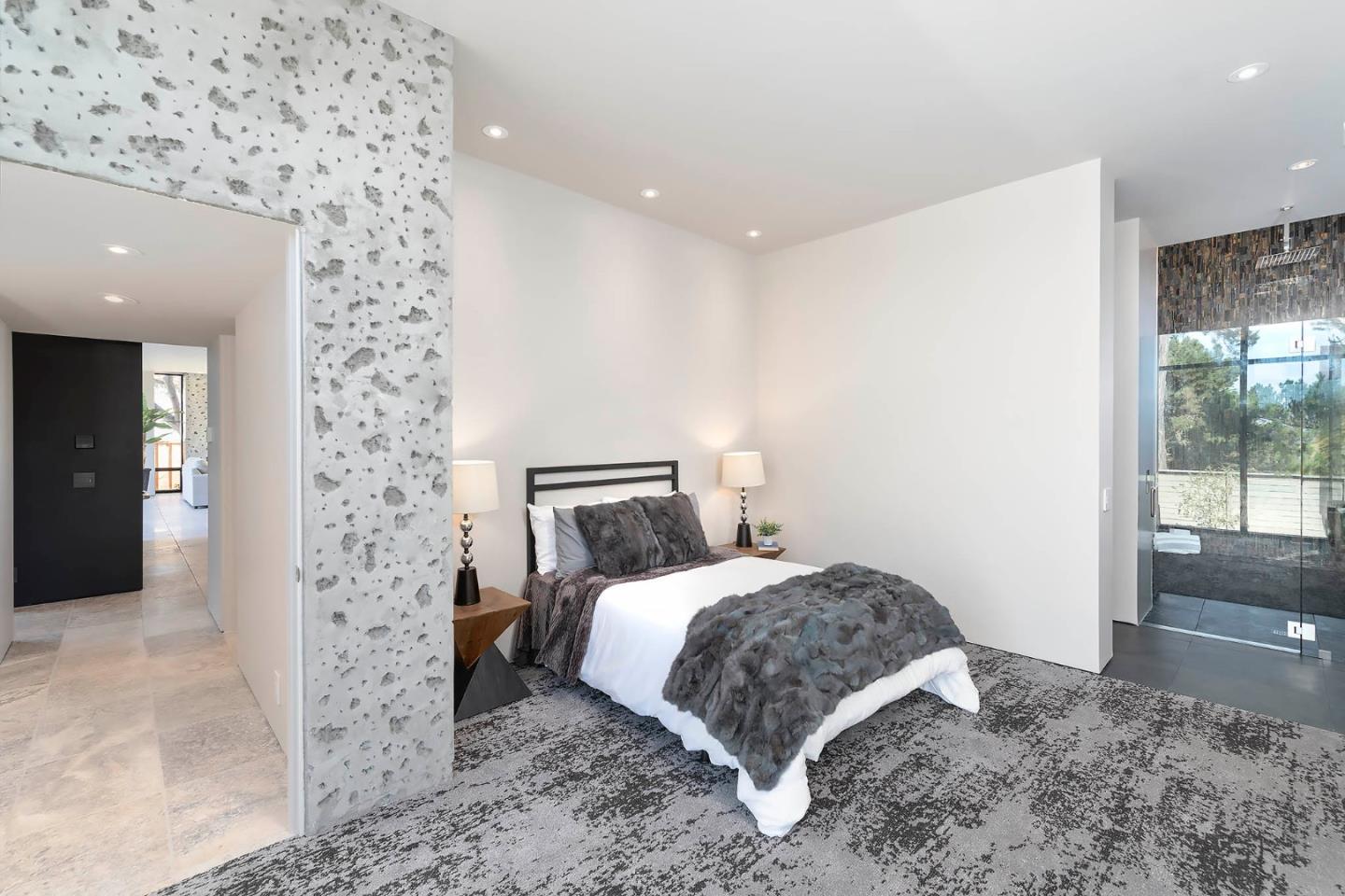 2889 17 Mile Drive Pebble Beach, CA 93953 - Photo 9 of 17 a bedroom with a bed and a view of bathroom