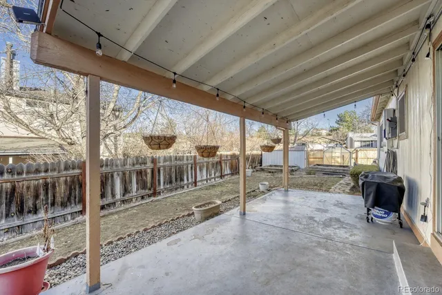 a view of a livingroom with furniture and a window