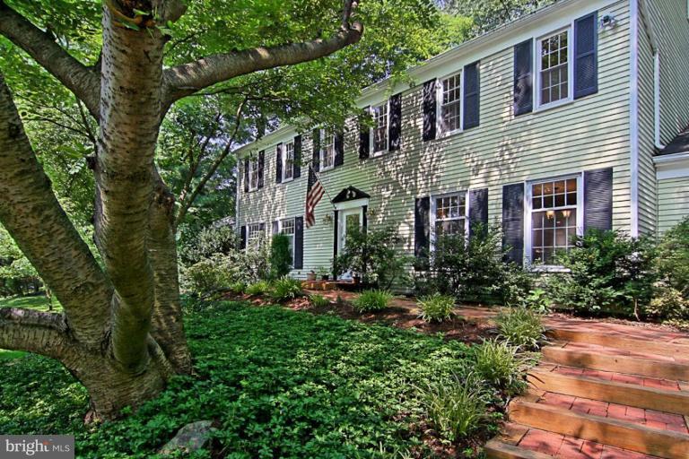 11412 Running Cedar Road Reston, VA 20191 - Photo 3 of 18 a front view of a house with lots of green space