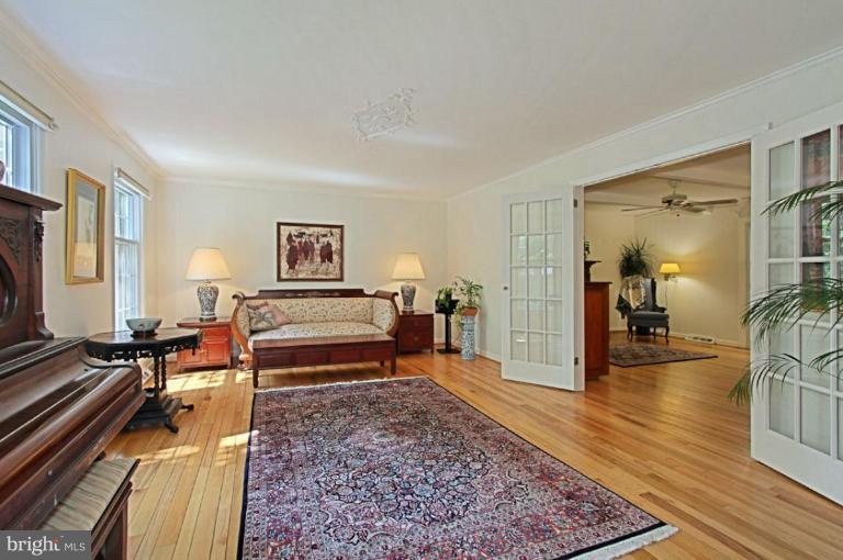 11412 Running Cedar Road Reston, VA 20191 - Photo 4 of 18 a bedroom with furniture and a wooden floor