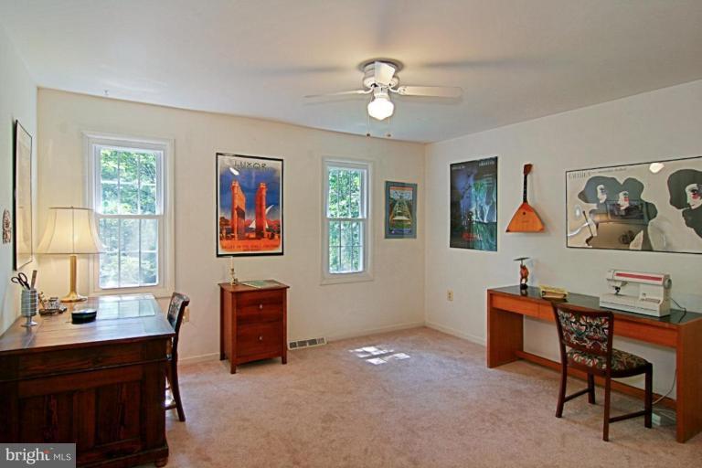 11412 Running Cedar Road Reston, VA 20191 - Photo 10 of 18 a living room with furniture and a chandelier