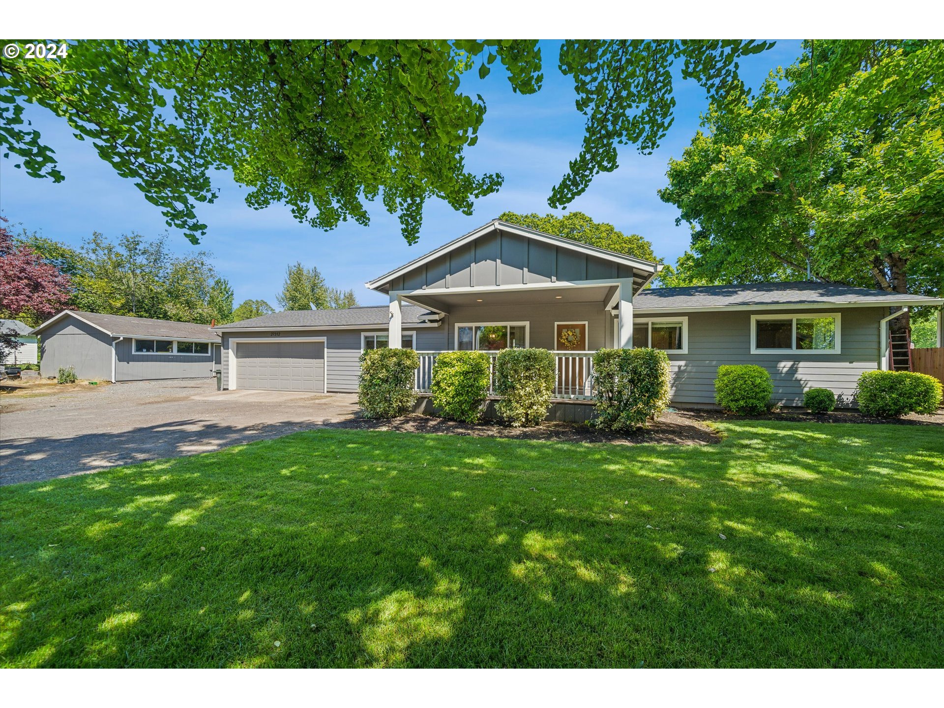 27312 South Gribble Road Canby, OR 97013 - Photo 5 of 41 a front view of a house with a yard