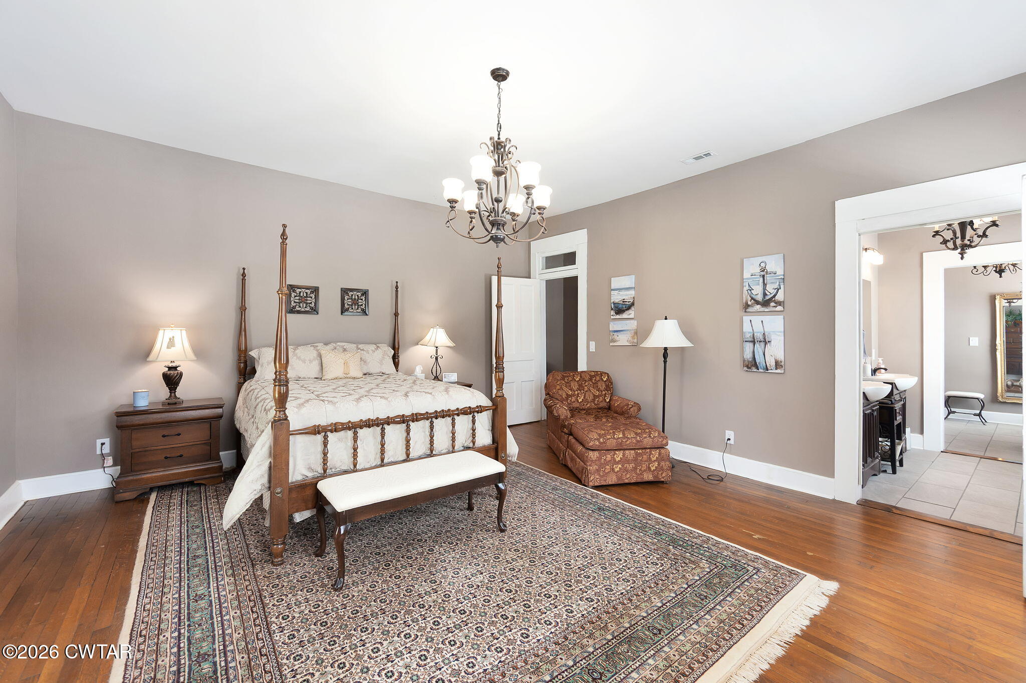 554 East Main Street Jackson, TN 38301 - Photo 30 of 60 a spacious bedroom with a bed and wooden floor