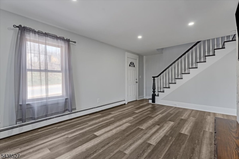 83 Highway 15 Lafayette, NJ 07848 - Photo 17 of 20 a view of an empty room with wooden floor and a window