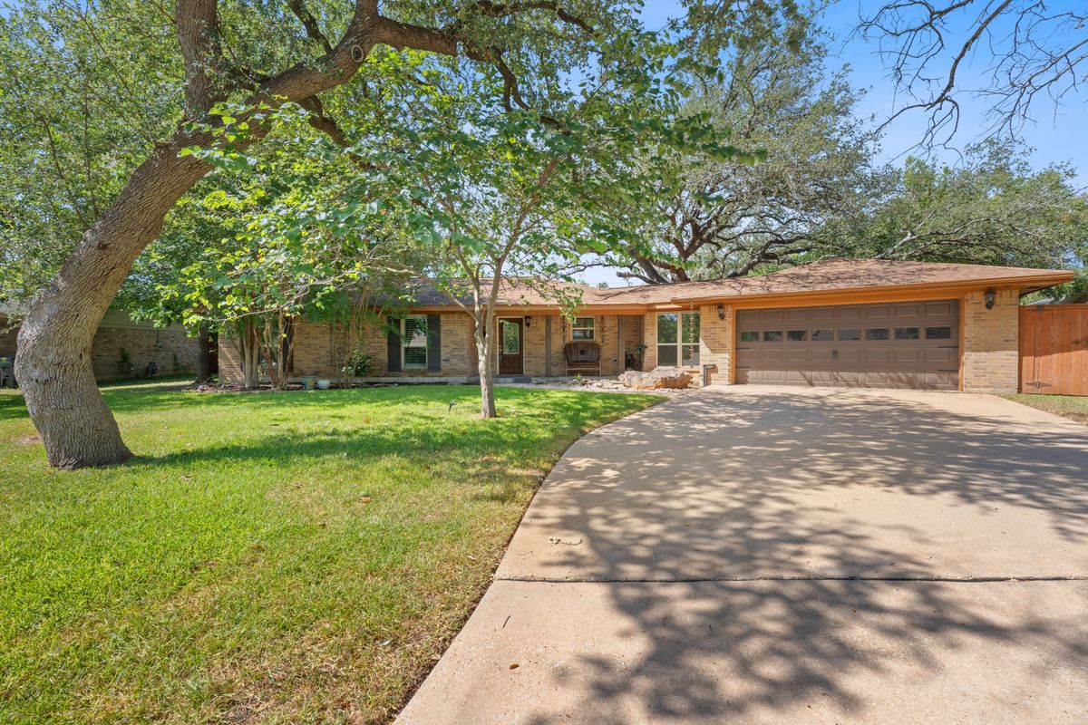 2002 Terry Lane Georgetown, TX 78628 - Photo 1 of 34 Ranch style home with mature oak trees