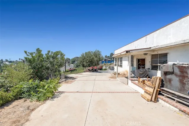 a backyard of a house with wooden fence